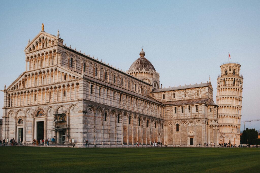 Affordable Education, Capture of the Leaning Tower and Pisa Cathedral at sunset in Italy.
