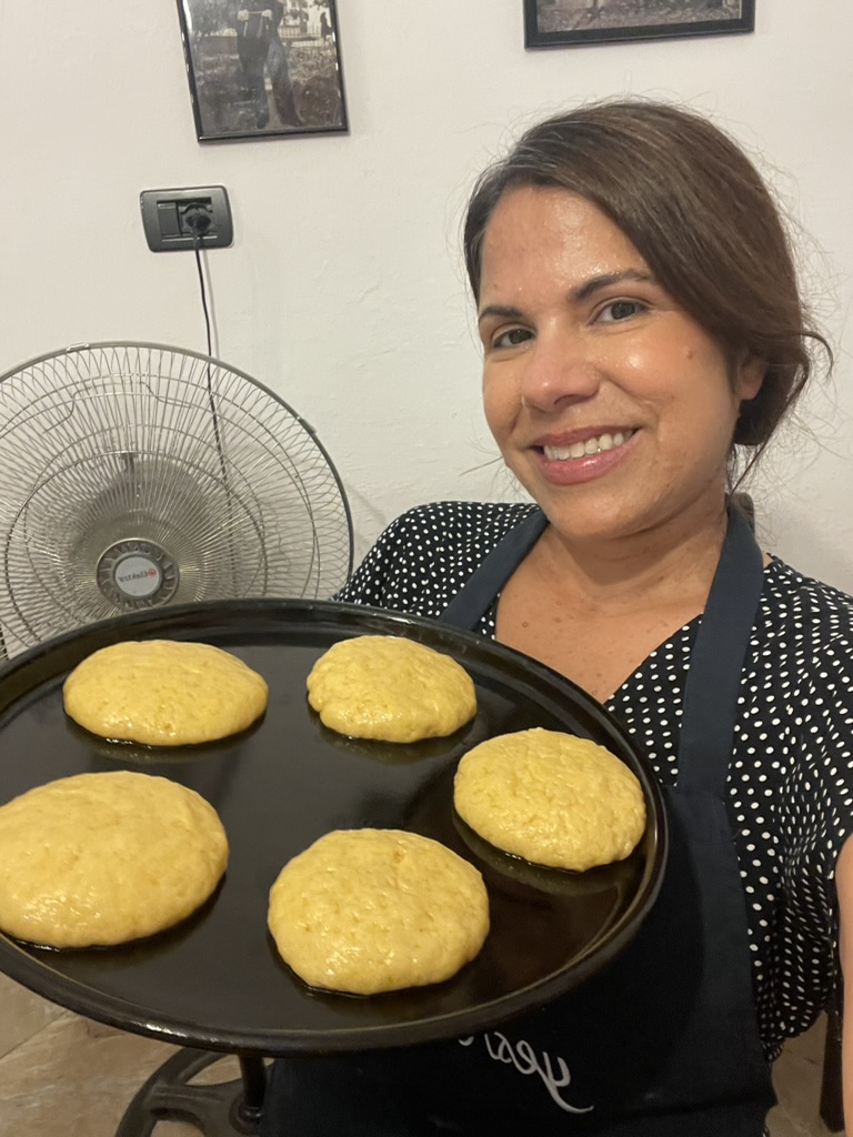 Tirana Cooking Class - Rita holding a pan of unbaked ballokume dough